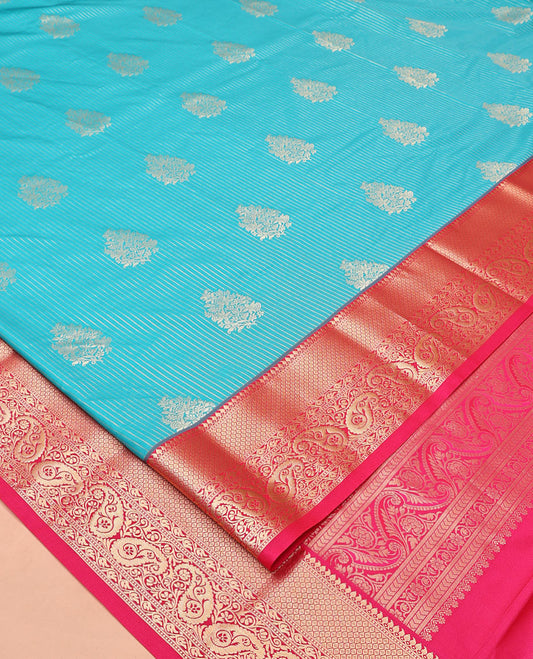 Peacock Green and Rani Pink Budget Silk Saree, Embellished with Vaira Oosi Stripes and Zari Buttas All Over Its Body, Complemented by Contrast Traditional Zari Designs Woven Border of Paisleys, Grand Pallu and Paired with a Contrast Blouse