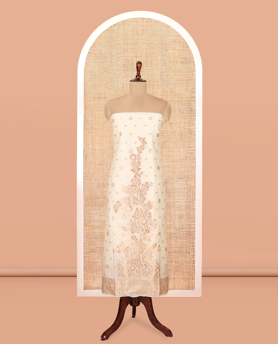 Kerala Cream Banarasi-Silk Material Churidar, Adorned with Floral Designs Top, a Plain Bottom, and Zari Design Dhavani