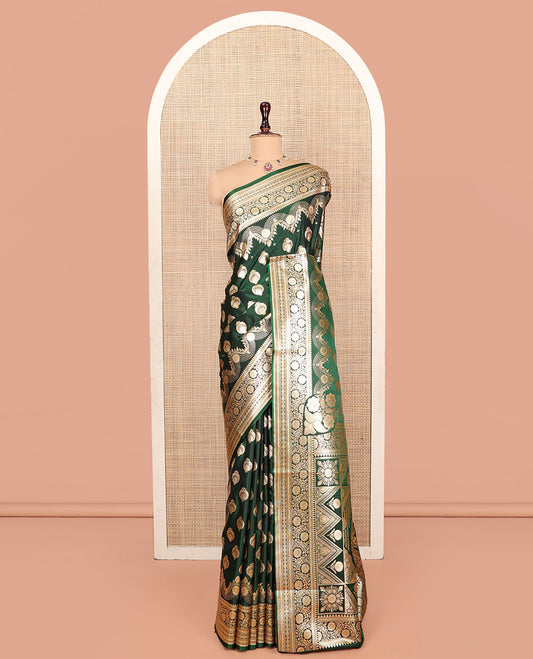 Green Banarasi Nylon Saree, Richly Detailed with Zari Buttas, Highlighted by a Traditional Zari Border, Intricate Pallu, and a Matching Blouse