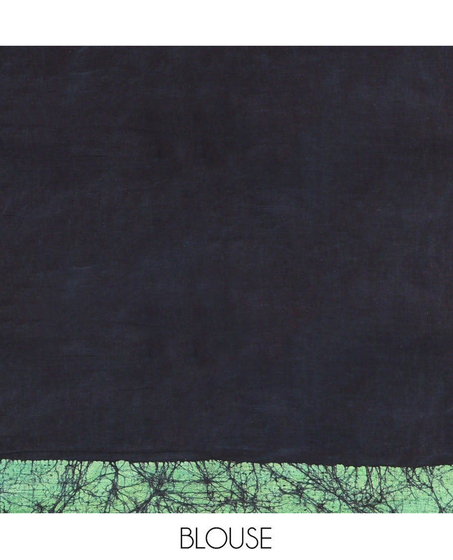 Navy Blue Mul Cotton Saree Enriched with Batik-Style Floral Motifs Printed All Over Its Body, Complemented by a Contrast Batik Printed Border, Pallu Mirrors the Same Batik Print, and Is Paired with a Matching Blouse
