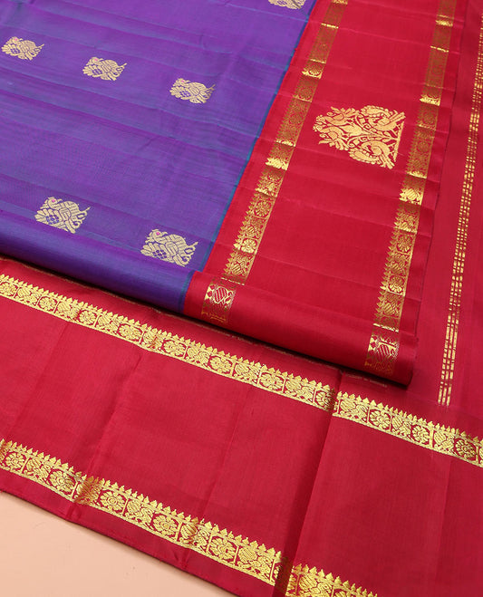 Violet Kanchipuram Silk Saree, Enthralled with Mayil Buttas on Its Body, Complemented by Contrast One-Sided Border of Mayil and Chakram Designs, Pallu Features Floral Designs, and Comes Without a Blouse