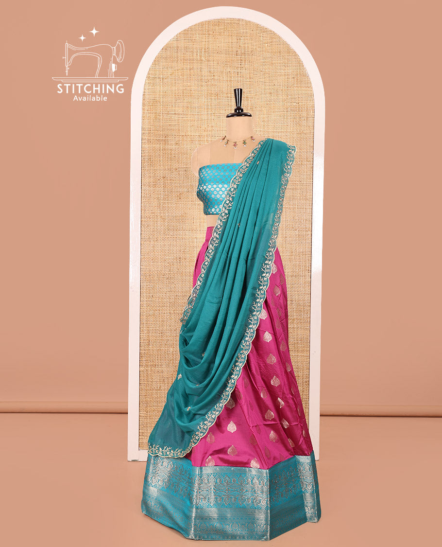 Rani Pink and Ferozi Color Semi-Banaras Silk Half-Saree Featuring Zari  Buttas All Over the Skirt, Highlighted with a Contrast Traditional Zari Design Border, Rudraksham Motifs Woven Blouse, and a Shimmer Georgette Scallop-Embroidered Dhavani