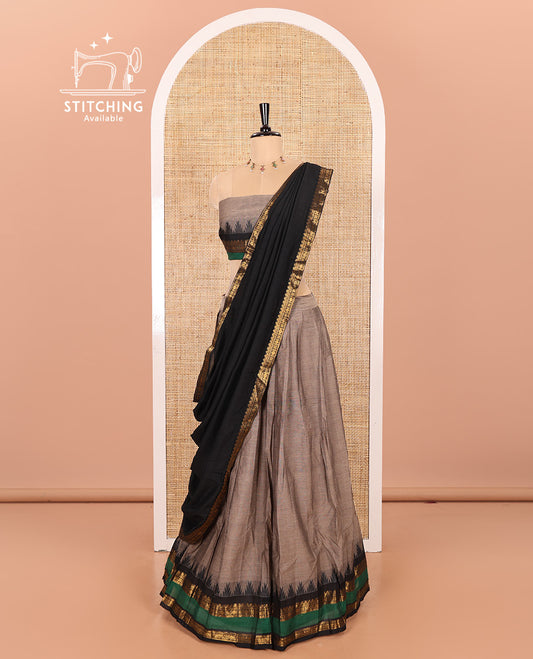 Steel Grey-Black Chettinad Cotton Half-Saree Featuring a Plain Skirt, Highlighted with a Contrast Traditional Zari Rettai Pettu Temple Border, a Subtly Woven Matching Blouse, and a Vichitra Silk Contrast Traditional Zari-Bordered Dhavani