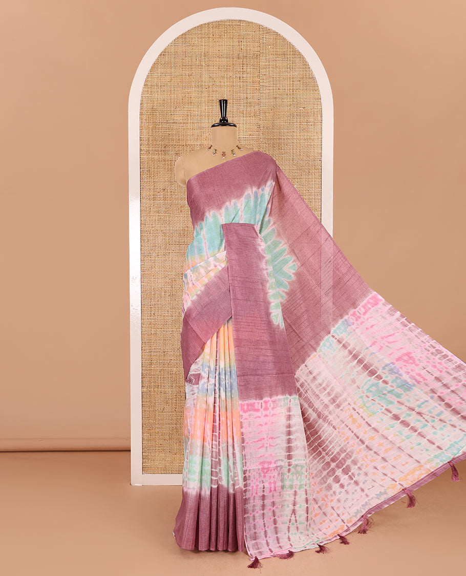 Multi color shibori printed jute tussar saree, contrast plain border, plain pallu with tussels, and contrast plain blouse