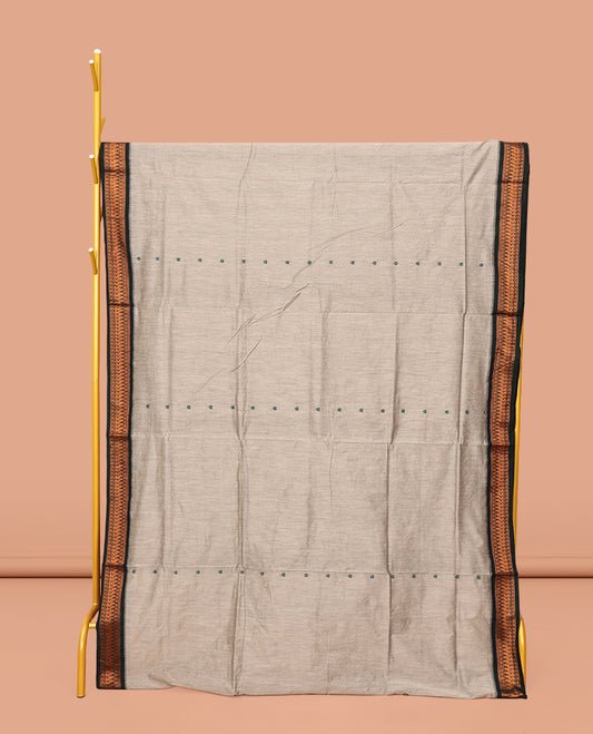 Grey Kalyani Cotton Saree, Delicately Woven with Thread Buttas All Over Its Body, Complemented by a Contrast Traditional Zari Design Border, Pallu Steeped with Peacock Designs, and Paired with a Contrast Blouse