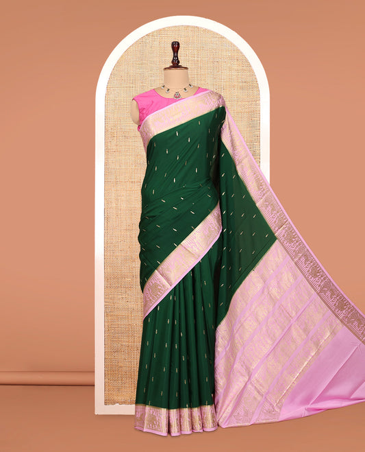 Green Mysore Silk Saree, Gleamed Up with Coin Zari Buttas, Complemented by a Contrast Traditional Zari Wedding Themed Border, a Rich Pallu, and Contrast Blouse