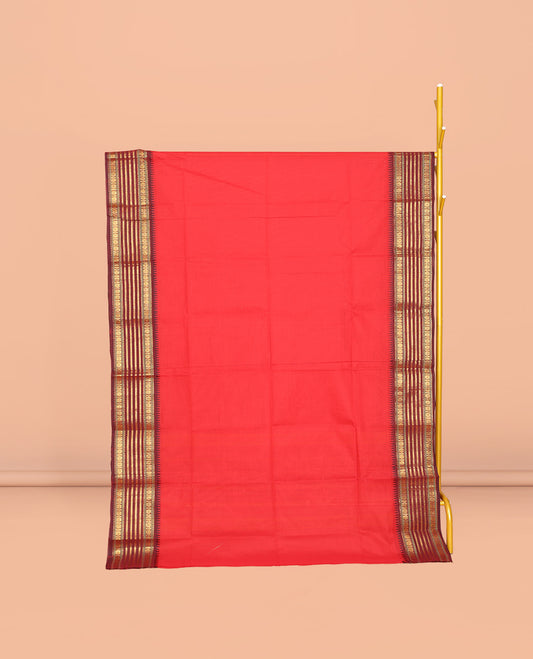 Red Plain Chettinad Cotton Saree, Complemented by a Contrast Traditional Zari Design Temple Border, Subtly Striped Pallu, and Paired with a Matching Blouse