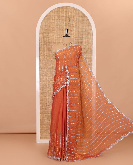Orange vertical stripes embroidered shimmer chiffon saree, scallop embroidered border, embroidered pallu, and fancy embroidered matching blouse