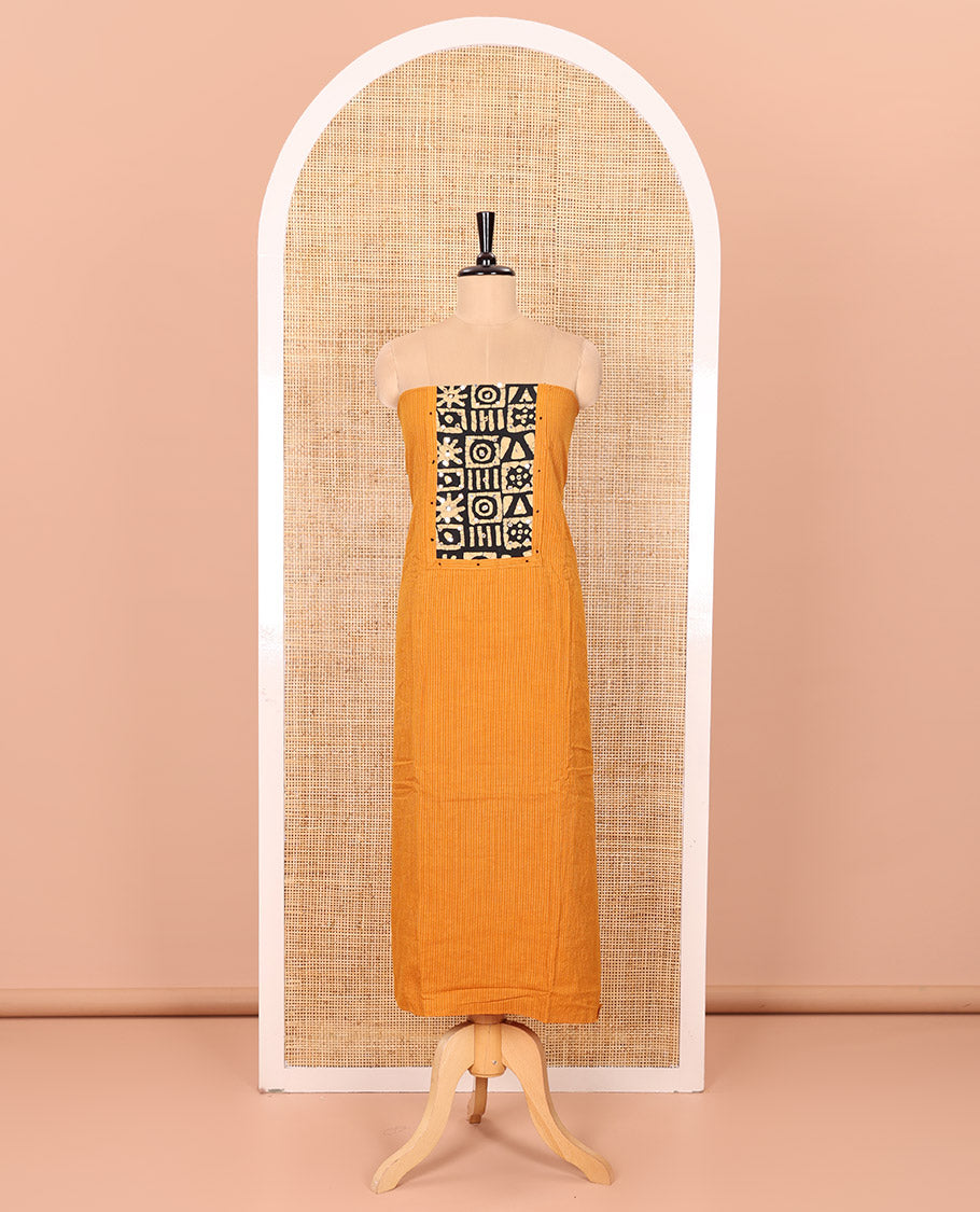 Mustard Material Chudidar Set Beautified with Kantha Embroidery, Batik Print, and Mirror Work on the Cotton Top, Comes with a Batik Geometric Patterns Printed Bottom, and a Cotton Batik Geometric Printed Dupatta