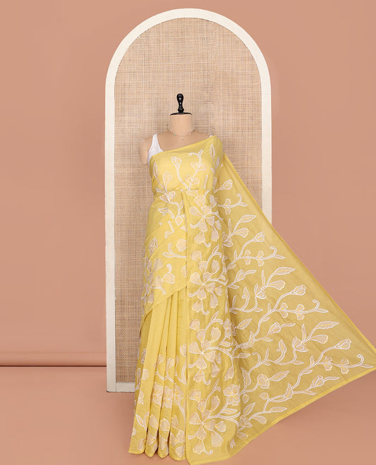 Yellow Fancy Tussar Saree, Artfully Detailed with Floral Vine Embroidery, a Subtle Scallop Border, and a Matching Blouse
