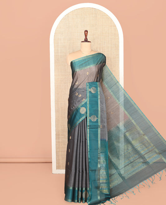 Grey Silk Cotton Saree, Adorned with Peacock and Rudraksha Buttas, Complemented by a Contrast Zari Buttas Border, Geometric Patterned Pallu, and a Contrast Blouse