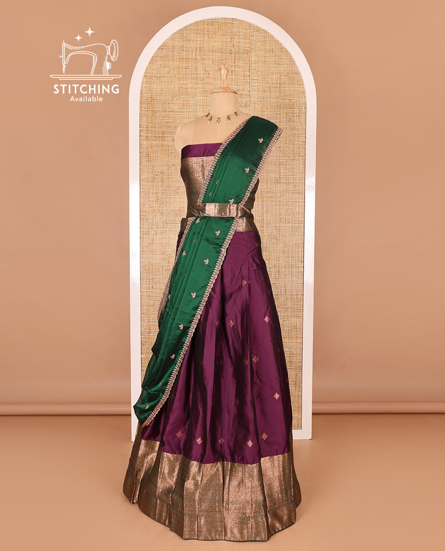 Dark violet taffeta silk half-saree, zari buttas and contrast traditional zari bordered skirt, a matching blouse, and contrast embroidered buttas dhavani