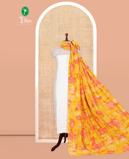 Cream-Orange Kerala Cream Mul Chanderi Material Churidar Features Pom-Pom Neckline Top, a Contrast Batik Floral Printed Bottom, and  Dupatta