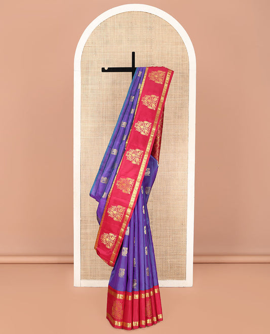 Violet Kanchipuram Silk Saree, Enthralled with Mayil Buttas on Its Body, Complemented by Contrast One-Sided Border of Mayil and Chakram Designs, Pallu Features Floral Designs, and Comes Without a Blouse