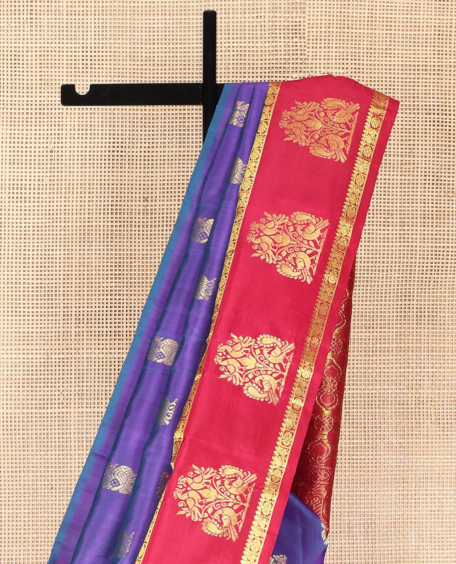 Violet Kanchipuram Silk Saree, Enthralled with Mayil Buttas on Its Body, Complemented by Contrast One-Sided Border of Mayil and Chakram Designs, Pallu Features Floral Designs, and Comes Without a Blouse