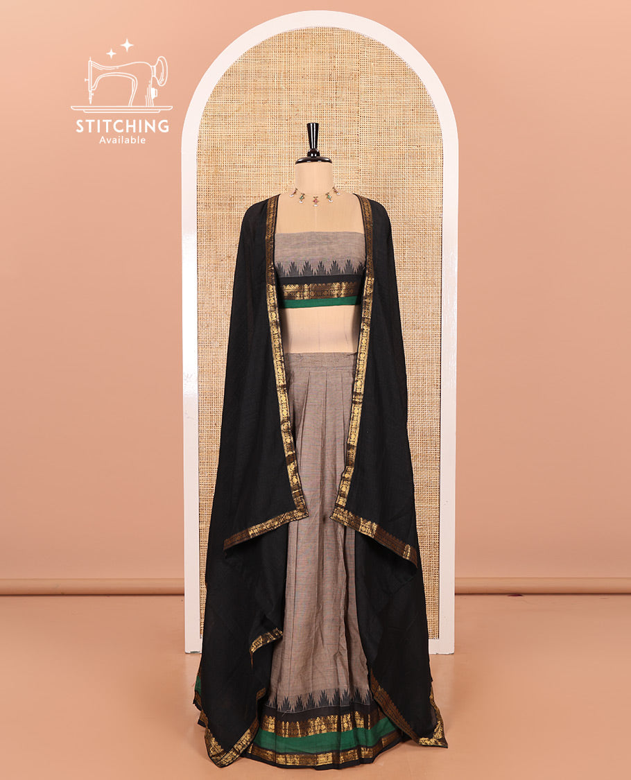 Steel Grey-Black Chettinad Cotton Half-Saree Featuring a Plain Skirt, Highlighted with a Contrast Traditional Zari Rettai Pettu Temple Border, a Subtly Woven Matching Blouse, and a Vichitra Silk Contrast Traditional Zari-Bordered Dhavani
