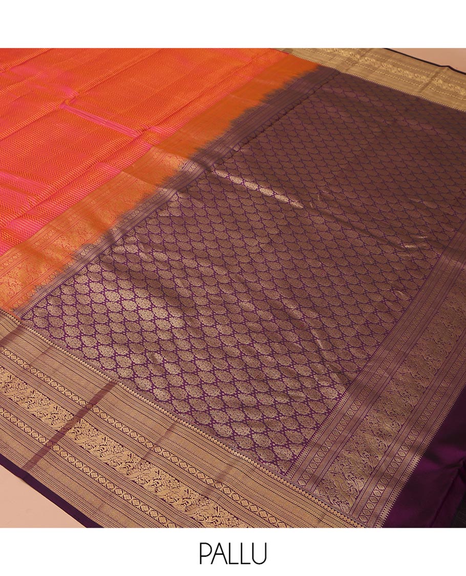 Orange Vasundhara Silk Saree, Gleamed Up with Stripes All Over Its Body, Complemented by a Contrast Border of Thilakam Mokku, Kathir, Vanki, Laddu Kamalam, and Mayil Designs, Intricately Designed Pallu, and Paired with a Contrast Blouse