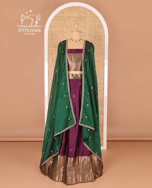 Dark violet taffeta silk half-saree, zari buttas and contrast traditional zari bordered skirt, a matching blouse, and contrast embroidered buttas dhavani