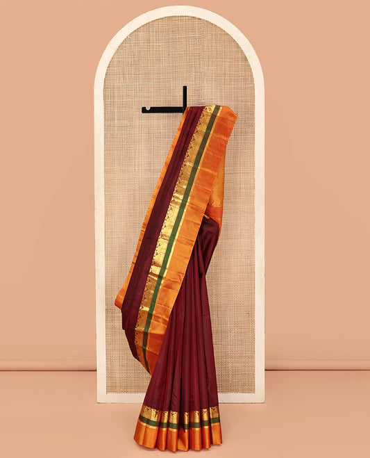 Maroon Kanchipuram Silk Saree, Sparsely Woven with Vazhaipoo Stripes on Its Body, Complemented by a Contrast Kal Erangina Border of Traditional Designs, Sparsely Woven Pallu, and Paired with a Contrast Blouse