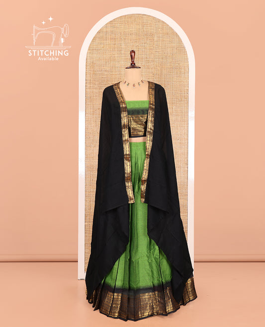 Leaf Green-Black Chettinad Cotton Half-Saree, Plain Contrast Traditional Zari-Bordered Skirt, Matching Blouse, and a Contrast Dhavani