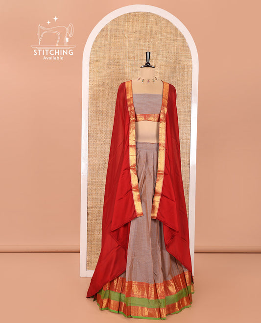 Grey Chettinad Cotton Half-Saree Featuring Plain Skirt, Complemented by Contrast Rettai Pettu Border of Round Peacock and Peacock Eye Designs, Paired with a Matching Blouse, and a Satin Georgette Zari Bordered Dhavani