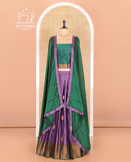 Lavender and green half-saree with paisley buttas with contrast traditional bordered taffeta silk skirt, a matching blouse, and a contrast bordered syska georgette dhavani