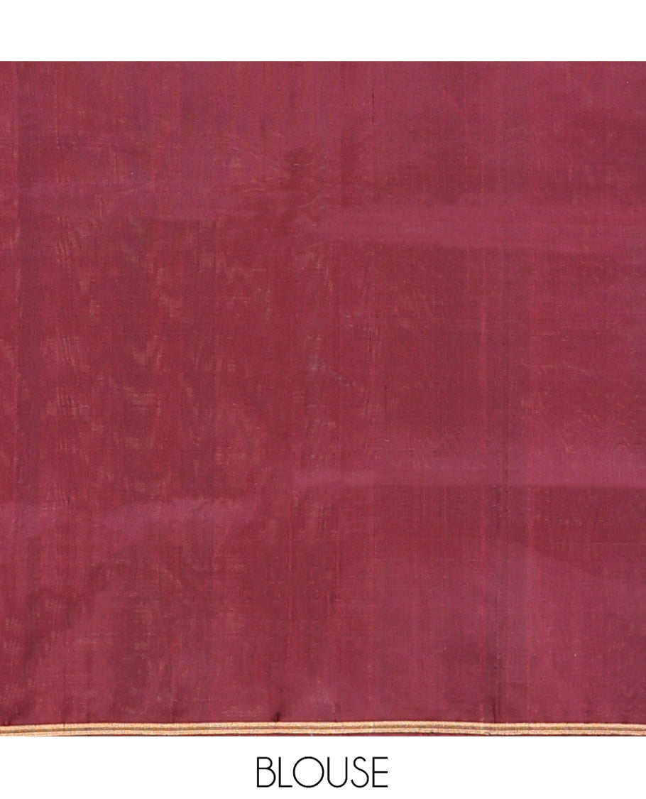 Maroon Mayuri Soft Silk Saree, Adorned with Zari Buttas All Over Its Body, Highlighted by Zari Border of Navagunjara Motifs, Pallu Steeped with Navagunjara Designs, and Paired with a Matching Blouse
