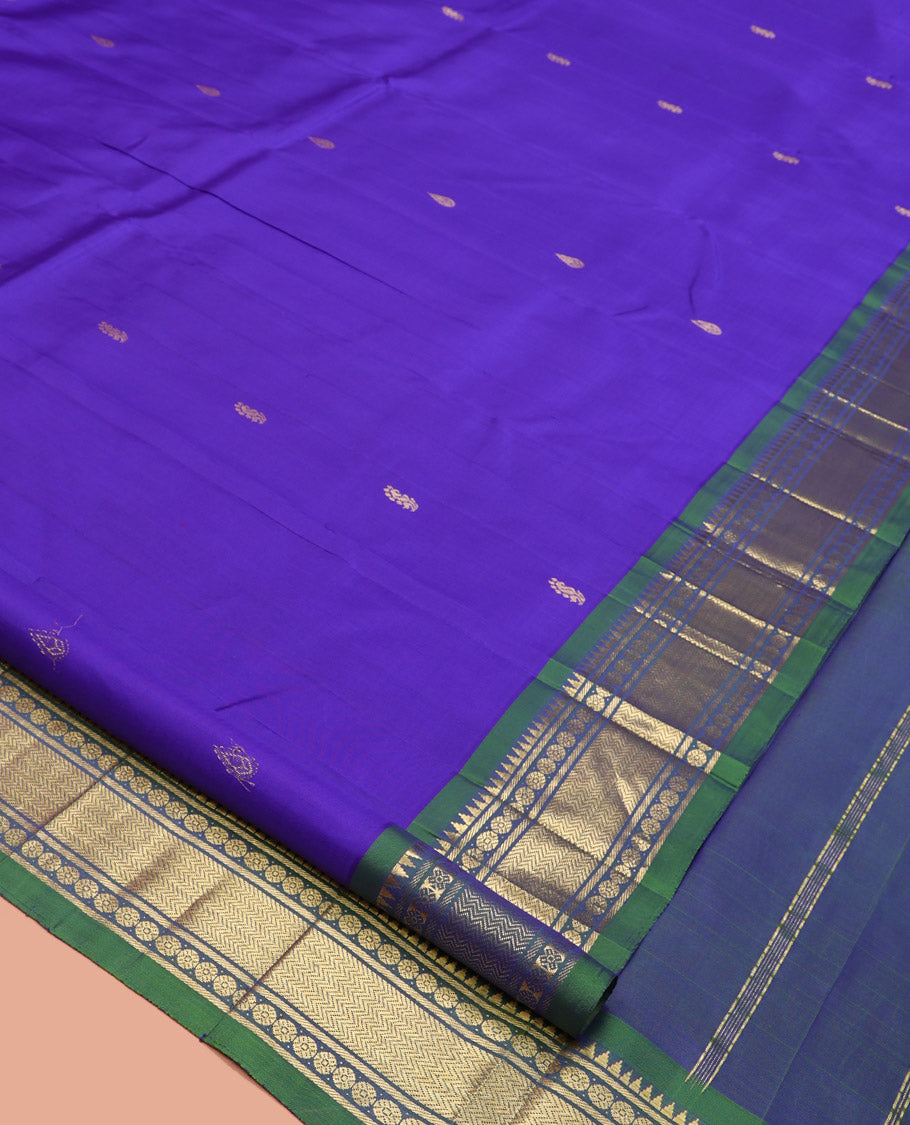 Violet Kanchipuram Silk Saree, Adorned with Zari Buttas, a Contrast One-Sided Border of Rekku, Rudraksham, and Vanki, a Zari-Design Pallu, and No Blouse