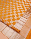 Yellow Checked Kanchipuram Wedding Silk Saree, Highlighted by a Zari Border, Intricately Designed Pallu, and Matching Blouse