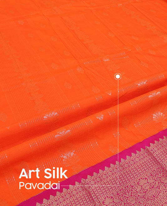 Orange Art Silk Pavadai Material Set, Adorned with Zari Designs All Over Its Skirt, Highlighted with a Contrast Traditional Zari Design Border, and Paired with a Contrast Blouse