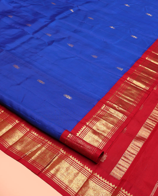 Royal Blue Kanchipuram Silk Saree, Adorned with Zari Buttas, Contrast Korvai One-Sided Border of Salngai, Banaras, Muthu, and Jaal, Zari Design Pallu, and No Blouse