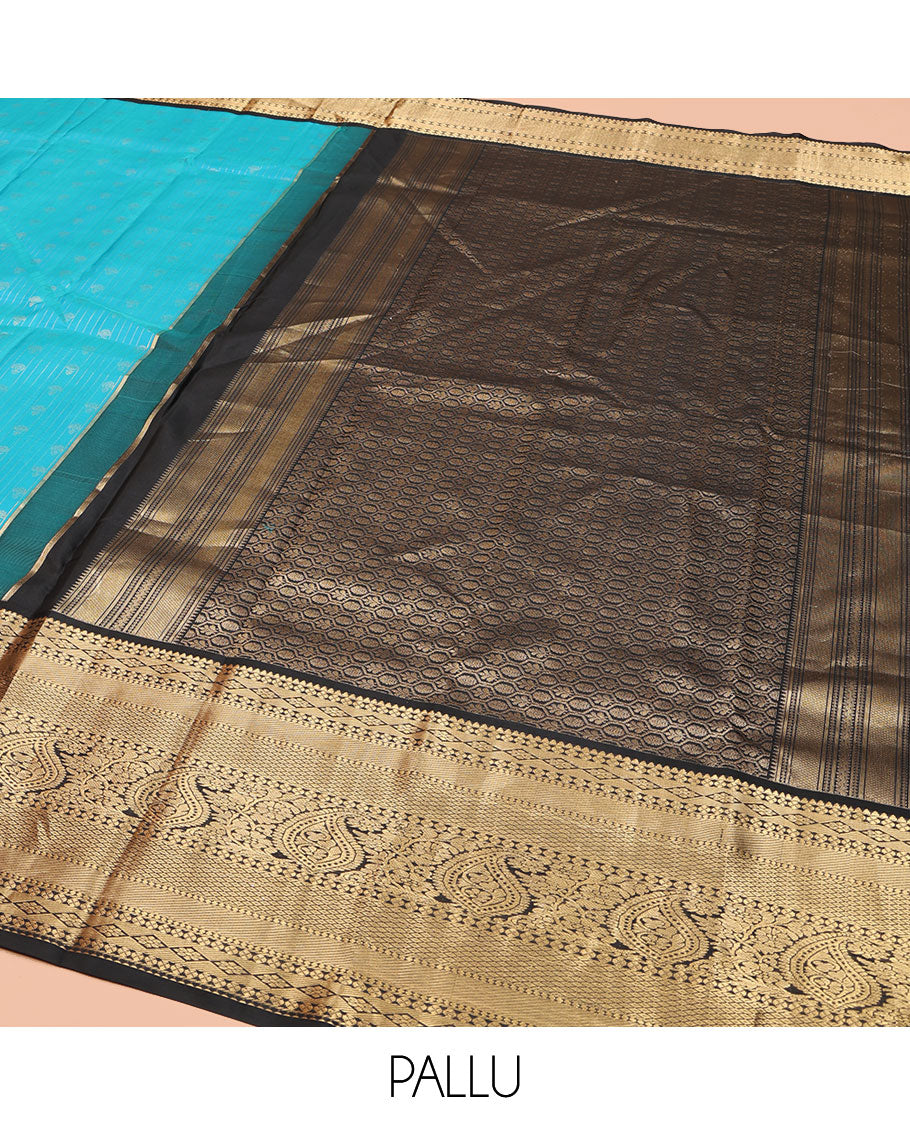 Blue Vasundhara Silk Saree, Adorned with Zari Buttas All Over Its Body, Complemented by Contrast Border of Rekku, Lavangam, Diamond, Mayil Kann, and Arumbu Manga Designs, Pallu of Mughal-Style Jaal Designs, and Paired with a Contrast Blouse