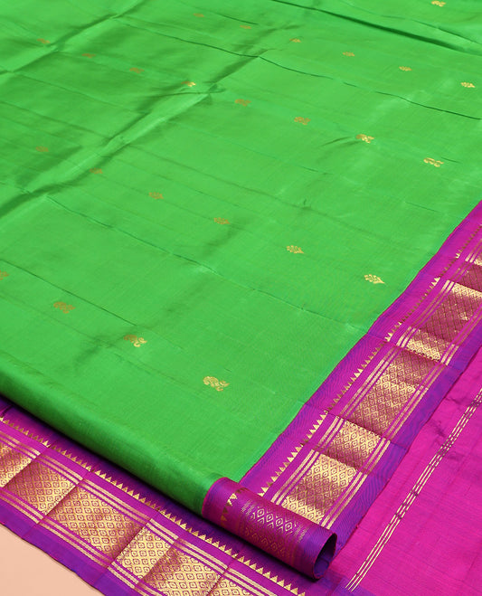 Green Kanchipuram Silk Saree, Adorned with Zari Buttas, Complemented by a Contrast One-Sided Korvai Border of Rekku, Banaras, and Jaal Designs, Zari Design Pallu, and No Blouse
