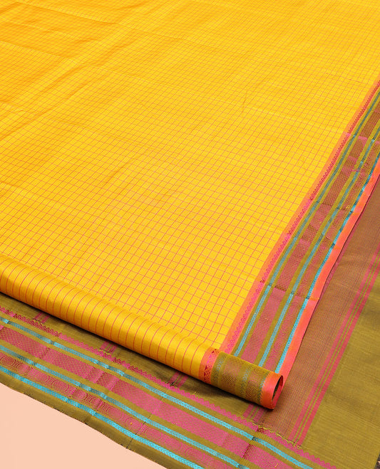 Yellow kanchipuram silk saree, subtly sparkled with checked design on its body, complemented by a contrast border of salngai, kathir, mayil kann, kathir, and rudraksham designs, a subtly striped pallu, and paired with a contrast blouse