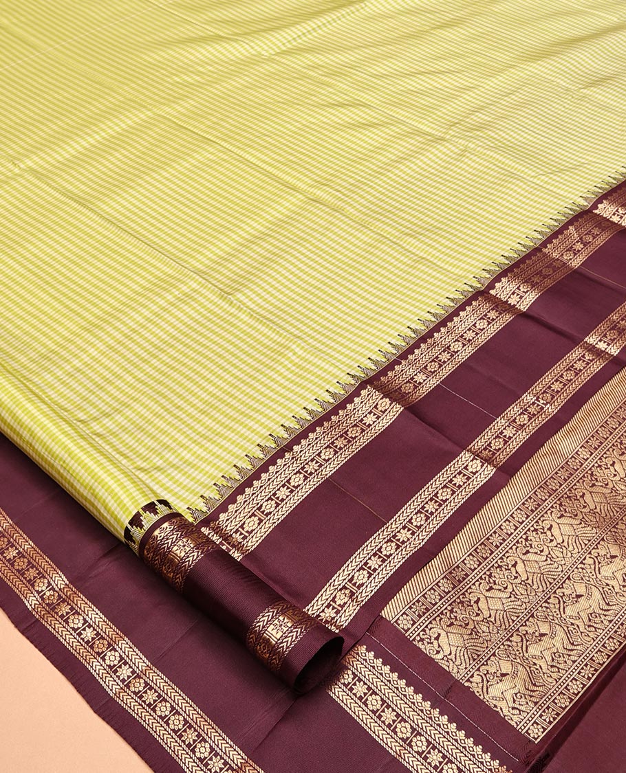 Green Vasundhara Silk Saree, Adorned with Kasa-Kasa-Style Checks, Complemented by a Contrast Rettai Pettu Border of Thazampoo Rekku, Salngai, Banaras, Kathir, Kamalam, and Star Designs, Gleaming Zari-Decked-Up Pallu and Paired with a Contrast Blouse