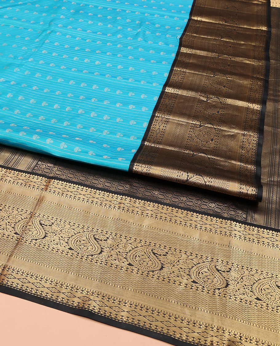 Blue Vasundhara Silk Saree, Adorned with Zari Buttas All Over Its Body, Complemented by Contrast Border of Rekku, Lavangam, Diamond, Mayil Kann, and Arumbu Manga Designs, Pallu of Mughal-Style Jaal Designs, and Paired with a Contrast Blouse