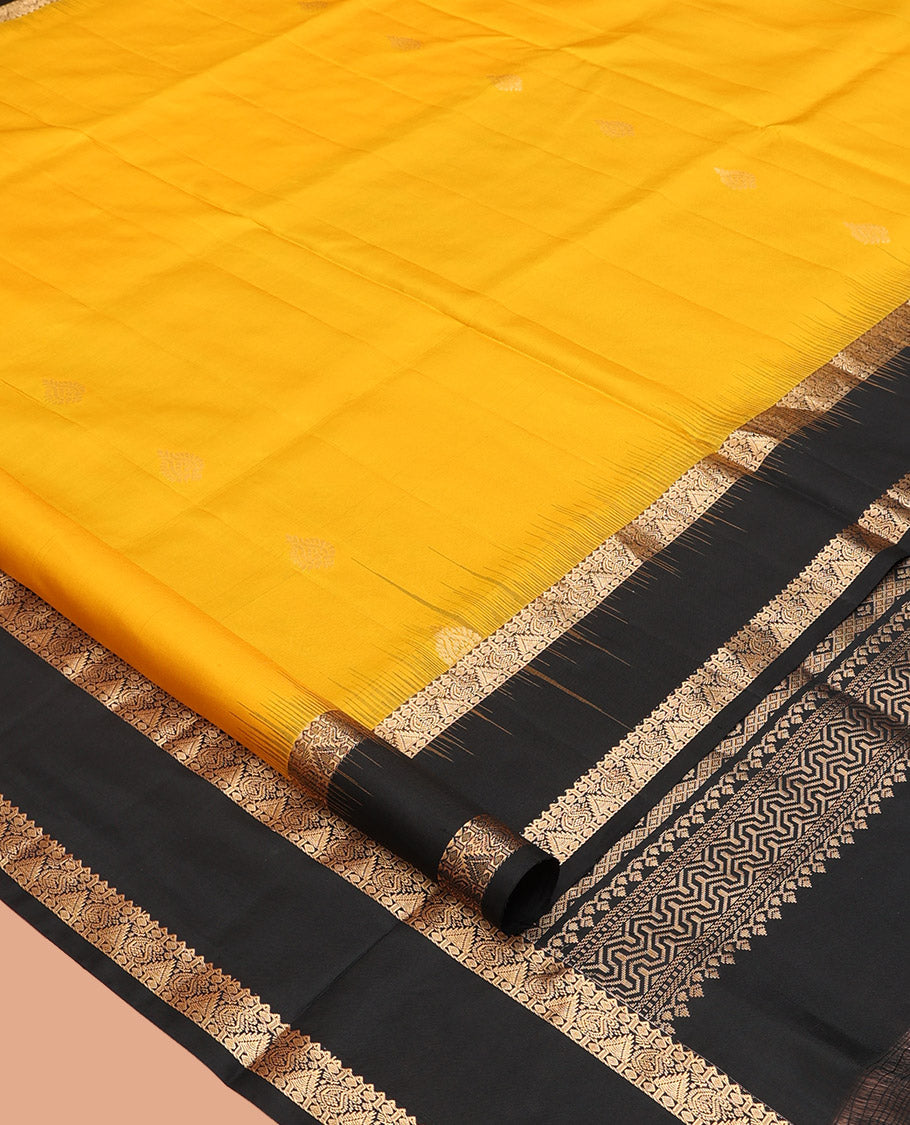 Yellow Mayuri Soft Silk Saree, Subtly Sparkled with Zari Buttas All Over Its Body, Complemented by a Contrast Border of Rekku, Paisa, Manga, and Thazampoo Rekku Designs, Intricately Designed Pallu, and Paired with a Contrast Blouse