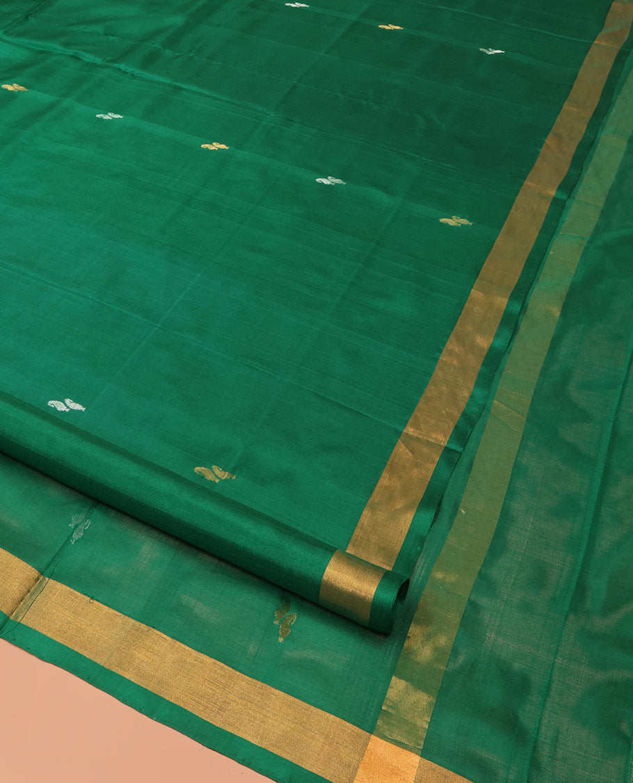 Green Uppada Silk Saree Entralled with Paisley Zari Buttas, Complemented by Bavanji Border, Pallu Depicting Zari Buttas, and Paired with a Matching Blouse