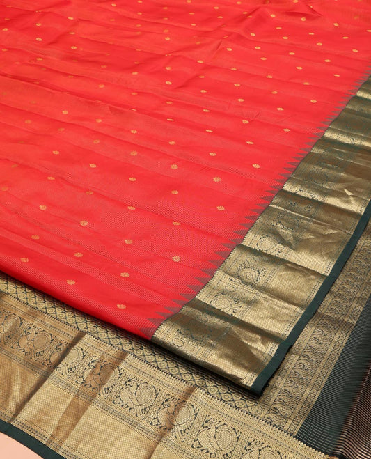 Red Vasundhara Lite Silk Mix Saree, Delicately Woven with Zari Buttas and Stripes, Complemented by a Contrast Border of Rekku, Muthu, Mayil, and Mayil Kann Designs, Pallu Steeped with Peacock Feather-Like Designs, and Paired with a Contrast Blouse
