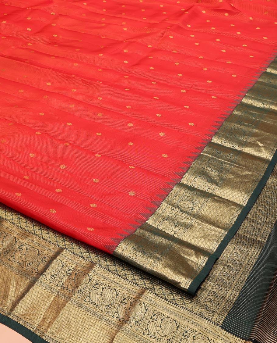 Red Vasundhara Lite Silk Mix Saree, Delicately Woven with Zari Buttas and Stripes, Complemented by a Contrast Border of Rekku, Muthu, Mayil, and Mayil Kann Designs, Pallu Steeped with Peacock Feather-Like Designs, and Paired with a Contrast Blouse