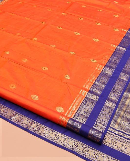 Orange Vasundhara Silk Saree, Adorned with Zari Buttas, Contrast Rettai Pettu Border of Yaanai, and Kuthirai Designs, Grand Pallu, and a Contrast Blouse