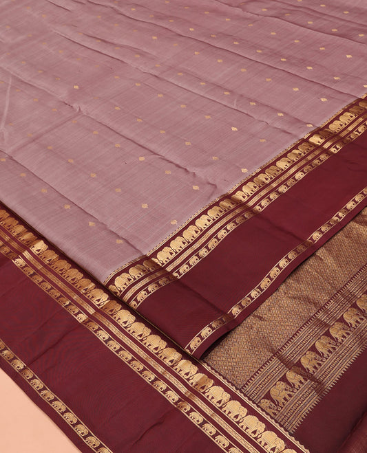 Grey Vasundhara Silk Saree, Adorned with Zari Buttas All Over Its Body, Complemented by a Contrast Rettai Pettu Border of Yaanai Designs, Grand Jaal Pallu, and Paired with a Contrast Blouse