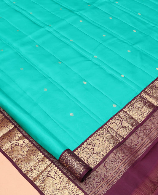 Blue Vasundhara Silk Saree, Adorned with Zari Buttas, a Contrast Korvai Border of Thilakam, Banaras, and Mayil Designs, Richly Woven Pallu, and a Contrast Blouse