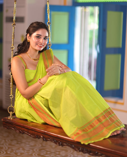 Leaf Green Plain Chettinad Cotton Saree, Delicately Decked Up with Traditional Thread Border Featuring Peacock and Ara Maadam Designs, Subtly Striped Pallu, and Paired with a Matching Blouse