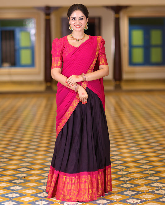 Violet and Rani Pink Plain Sungudi Cotton Half-saree, Complemented by Captivating Contrast Traditional Zari Border of Temple, Peacock, and Elephant Designs, Paired with a Contrast Zari Checked Blouse, and Comes with a Zari-Bordered Vichitra Silk Dhavani