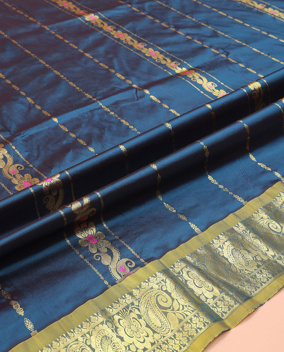 Blue Pure Silk Half-Saree, Adorned with Zari Designs on Its Body, Complemented by a Contrast Floral and Paisley Design Border, Complemented by a Contrast Blouse, and Paired with a Contrast Dhavani of Leaf-Paisley Designs