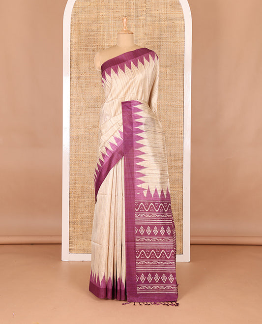 Chikku-purple plain Khicha katan silk saree, contrast purple temple border, ikkat printed pallu with tassels, and a contrast blouse