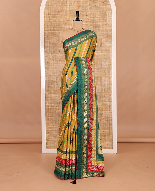Gold leheriya striped printed, mirror and stone work moss chiffon saree, contrast bandhani printed mirror work border, floral print, mirror and stone work pallu with a contrast plain blouse