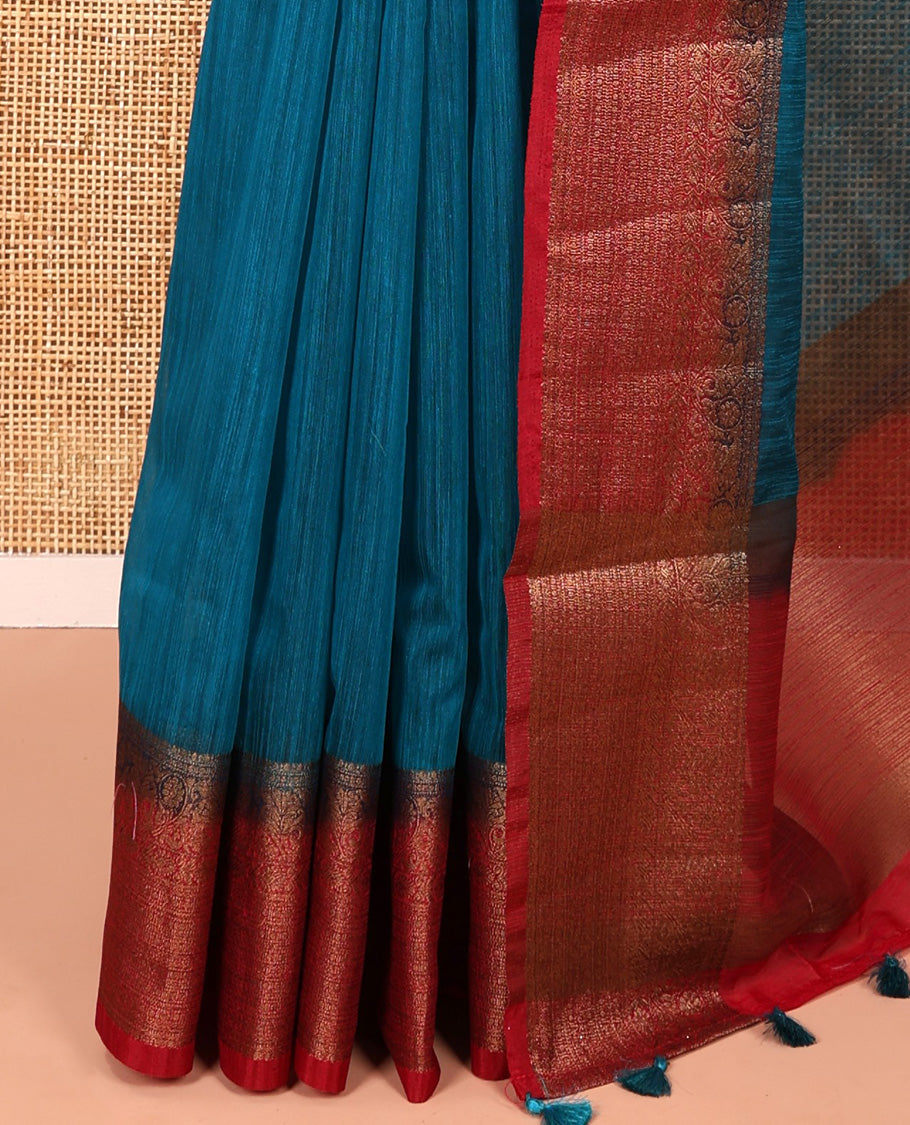Rama blue plain linen saree, contrast traditional zari design border, striped pallu, and a contrast embroidered blouse