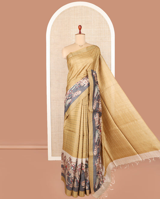Gold horizontal striped tussar silk saree, Pichwai cow motifs printed border, and striped pallu